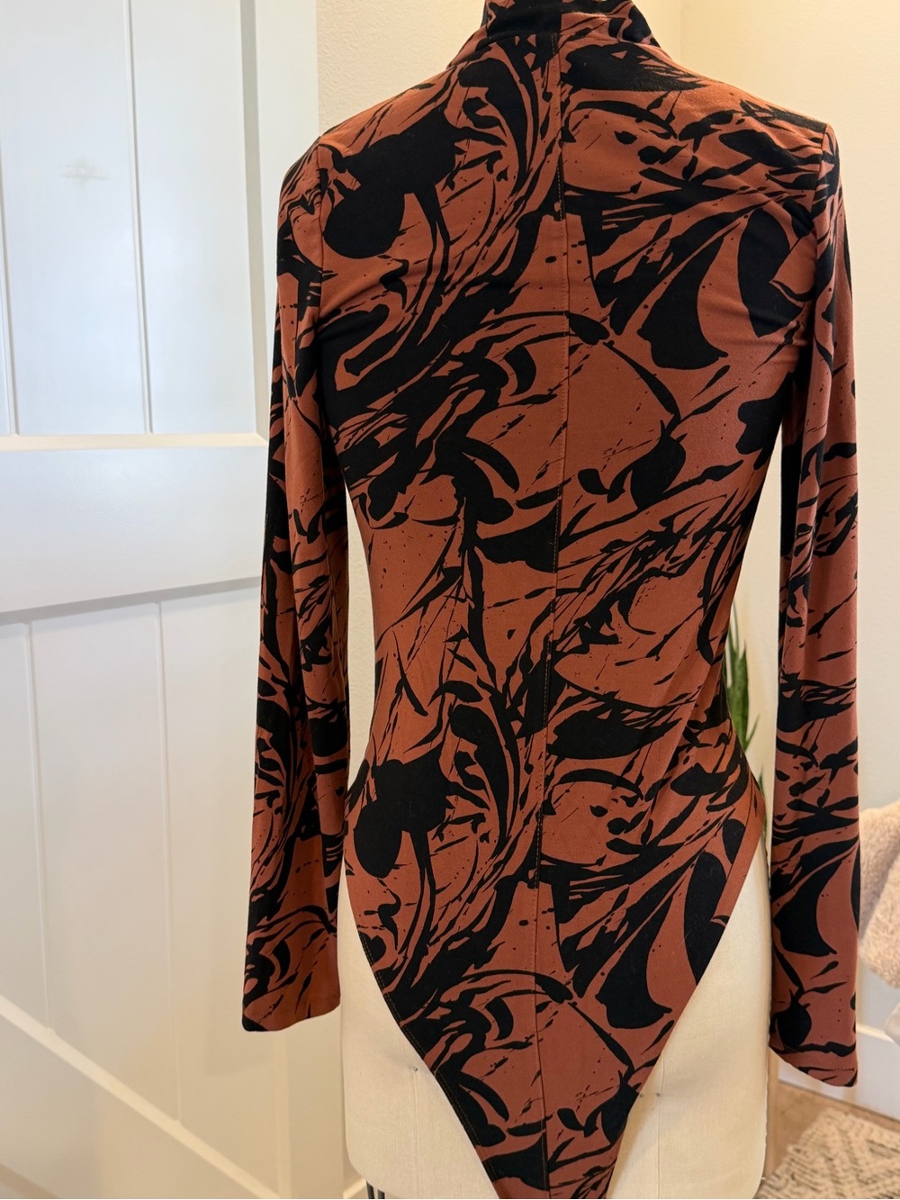 Abstract Rust & Black Long-Sleeve Bodysuit